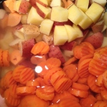 Add potatoes, water and frozen carrots to a stock pot.